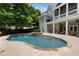 Beautiful backyard pool and patio area surrounded by lush greenery at 2429 Kirk Nw Ln, Kennesaw, GA 30152