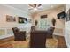 Sitting room boasts a neutral color palette, hardwood floors and a cozy seating arrangement at 2429 Kirk Nw Ln, Kennesaw, GA 30152