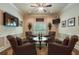Sitting room features hardwood floors, neutral tones, and four comfortable patterned chairs at 2429 Kirk Nw Ln, Kennesaw, GA 30152