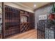 Custom wine cellar with brick accents, wood racking, and ample storage space at 2429 Kirk Nw Ln, Kennesaw, GA 30152