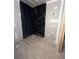 The shower stall is prepped for finishing in the unfinished bathroom at 308 Fortune Ne St # A, Atlanta, GA 30312