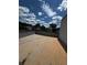 Open roof deck view showcasing blue sky, puffy clouds and city buildings and trees at 308 Fortune Ne St # A, Atlanta, GA 30312