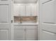 Convenient bar area with cabinets, sink, and quartz countertop at 6 Alston Place Ne Ne Pl, Atlanta, GA 30324