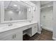 Bright bathroom featuring double sinks, quartz countertop, and tiled shower at 6 Alston Place Ne Ne Pl, Atlanta, GA 30324