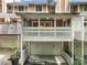 Exterior of townhomes showing multiple garages, balconies, and outdoor spaces at 6 Alston Place Ne Ne Pl, Atlanta, GA 30324