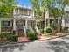 Inviting townhome exterior with lush landscaping, brick entryway, and traditional architecture at 6 Alston Place Ne Ne Pl, Atlanta, GA 30324
