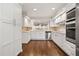 Bright modern kitchen featuring white cabinets, stone backsplash, and stainless appliances at 6 Alston Place Ne Ne Pl, Atlanta, GA 30324