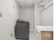 Functional laundry room with modern washer and dryer and ample storage at 6 Alston Place Ne Ne Pl, Atlanta, GA 30324