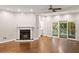 Inviting living room with a fireplace and access to an outdoor deck through sliding glass doors at 6 Alston Place Ne Ne Pl, Atlanta, GA 30324