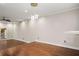 Bright living room with hardwood floors, recessed lighting, and modern light fixture at 6 Alston Place Ne Ne Pl, Atlanta, GA 30324