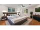 Bright main bedroom with modern decor, ceiling fan and a view of the trees outside at 6 Alston Place Ne Ne Pl, Atlanta, GA 30324