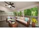 Relaxing screened-in patio area with comfortable seating and a view of the lush greenery at 6 Alston Place Ne Ne Pl, Atlanta, GA 30324