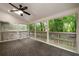 Inviting screened porch with ceiling fan and views of mature trees at 6 Alston Place Ne Ne Pl, Atlanta, GA 30324