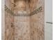 Bathroom featuring tiled walk-in shower with bronze and grey accents at 6 Alston Place Ne Ne Pl, Atlanta, GA 30324
