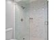 Frameless shower with marble-look tile surround and built-in niche at 6 Alston Place Ne Ne Pl, Atlanta, GA 30324