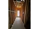 Unfinished hallway with natural light streaming in and wood framing showcasing the building process of this new home at 308 Fortune Ne St # B, Atlanta, GA 30312