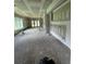 Spacious interior with unfinished drywall, large windows, and a door to the backyard at 308 Fortune Ne St # B, Atlanta, GA 30312