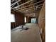 Unfinished living room during construction showcasing wood framing, window and sliding doors with natural light at 308 Fortune Ne St # B, Atlanta, GA 30312