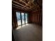 Unfinished living room during construction showcasing wood framing and sliding doors with natural light at 308 Fortune Ne St # B, Atlanta, GA 30312
