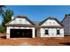 New construction home features a two-car garage and is ready for a new Gathering at 498 Charleston Pl, Villa Rica, GA 30180