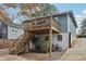 The property features a wooden deck with stairs, leading to a gravel area and potential parking at 761 Bellemeade Nw Ave, Atlanta, GA 30318