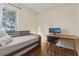 Sunlit bedroom with hardwood floors, a desk and neutral decor at 761 Bellemeade Nw Ave, Atlanta, GA 30318