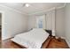 Neutral bedroom with hardwood floors, natural light and minimalist furnishings offer a serene retreat at 761 Bellemeade Nw Ave, Atlanta, GA 30318