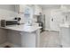 Bright kitchen with stainless steel appliances and stylish white countertops at 761 Bellemeade Nw Ave, Atlanta, GA 30318