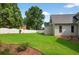 Beautifully manicured backyard with lawn and patio area at 2559 Dunhaven Gln, Snellville, GA 30078