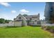 Spacious backyard with lush green grass and a well-maintained white fence at 2559 Dunhaven Gln, Snellville, GA 30078