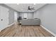 Finished basement area with gray walls, vinyl floors, and a decorative tile ceiling with fan at 2559 Dunhaven Gln, Snellville, GA 30078