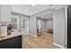 Open concept basement featuring wood-look floors, kitchenette, and a living area at 2559 Dunhaven Gln, Snellville, GA 30078