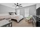 Bright bedroom with two windows, a ceiling fan, and plenty of space for a crib at 2559 Dunhaven Gln, Snellville, GA 30078