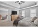 Spacious bedroom with tray ceilings, ceiling fan, plenty of natural light, and open doorway at 2559 Dunhaven Gln, Snellville, GA 30078