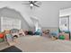 Bonus room features neutral carpet, bright windows, and comfortable seating at 2559 Dunhaven Gln, Snellville, GA 30078