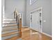 Spacious foyer with hardwood floors, staircase, high ceilings and a front door with sidelight windows at 2559 Dunhaven Gln, Snellville, GA 30078