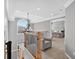 Upstairs hallway features a sitting area with an arched window and view into the bedroom at 2559 Dunhaven Gln, Snellville, GA 30078