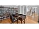 Home office space with custom shelving, desk and seating. Hardwood floors provide a bright space at 2559 Dunhaven Gln, Snellville, GA 30078