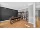 Stylish home office with custom shelving, hardwood floors, gray walls with custom molding, and plenty of light at 2559 Dunhaven Gln, Snellville, GA 30078