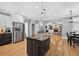 Bright kitchen with stainless steel appliances, island with seating, and open layout to other living areas at 2559 Dunhaven Gln, Snellville, GA 30078