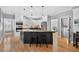 Spacious kitchen featuring an island, stainless steel appliances, and a seamless flow to other living spaces at 2559 Dunhaven Gln, Snellville, GA 30078