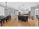 Bright, open kitchen with stainless steel appliances, large island, hardwood flooring, and a view of a dining area at 2559 Dunhaven Gln, Snellville, GA 30078