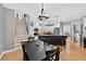 Open kitchen with stainless steel appliances, granite counters, large island, and hardwood flooring at 2559 Dunhaven Gln, Snellville, GA 30078