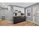 Basement kitchenette includes cabinets, counter, sink, microwave and doorway to outside at 2559 Dunhaven Gln, Snellville, GA 30078