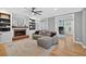 Inviting living room with a brick fireplace, built-in bookshelves, and a comfortable sofa at 2559 Dunhaven Gln, Snellville, GA 30078