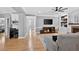 Spacious living room with hardwood floors, TV console, and a comfortable gray sofa at 2559 Dunhaven Gln, Snellville, GA 30078