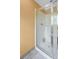 Bathroom featuring glass shower doors, neutral walls, and tiled floor at 2670 Trotters Pointe Drive Dr, Snellville, GA 30039