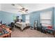 Spacious bedroom with a ceiling fan, carpeted floors, and two windows for natural light at 2670 Trotters Pointe Drive Dr, Snellville, GA 30039