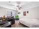 Neutral bedroom featuring plush carpeting, a ceiling fan, and cheerful decorations at 2670 Trotters Pointe Drive Dr, Snellville, GA 30039
