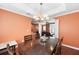 Open-concept dining room with view into living room with hardwood floors and ample seating at 2670 Trotters Pointe Drive Dr, Snellville, GA 30039